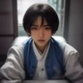 陈晓明，资深平面设计师，ai抠图指南主编，正在工作室审阅设计稿